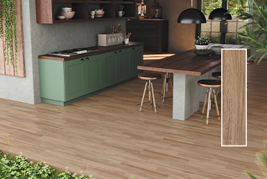 Cerámica en piso de cocina con mesonera de cocina de madera y otro meson verde con accesorios de cocina