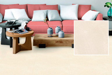 Porcelanato 60x60 cm en hogar con aciento rosa y cojines blancos