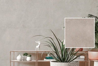 Porcelanato gris en pared decorativo antideslizante con plantas verdes y pieza de ceramica 60x60cm gris
