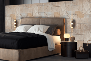 Ambiente de un dormitorio master con las paredes recubiertas de piedra natural decorativa.