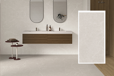 Omega-porcelanato-baño-gris bamo moderno con piso de porcelanato gris y pared blanca con dos espejos redondos grandes y una encimera de madera